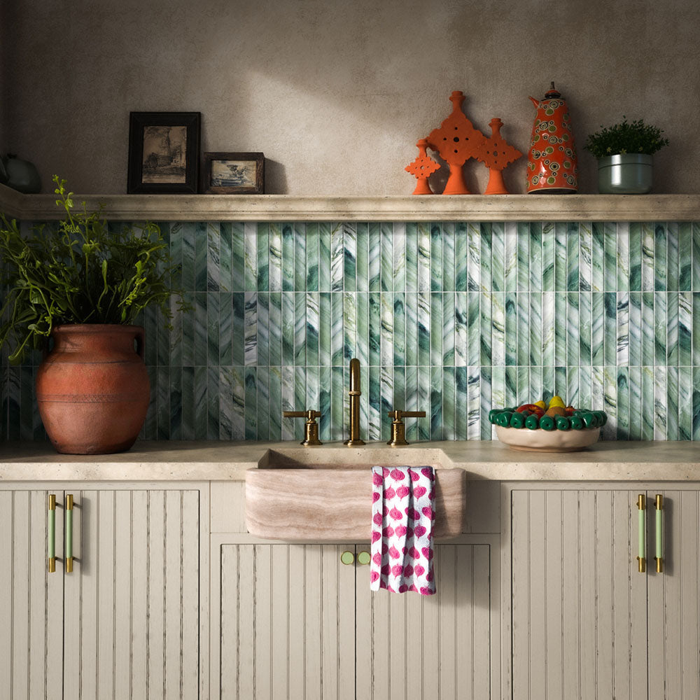 Kitchen featuring Crete Fluted Jade Matt 11.5x23cm green marble-effect wall tiles with fluted detailing, styled with rustic cabinetry, brass fixtures, natural stone worktops, and Mediterranean-inspired décor.