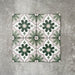 Clara Jade Mini Victorian Moroccan-style porcelain floor tiles in a 15 × 15cm format, laid in a repeating pattern to showcase the green geometric design across the floor.