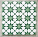 Agadir Green Moroccan-style 20x20cm porcelain tiles arranged as four tiles, showcasing a repeating geometric star pattern in green and white on a neutral background.