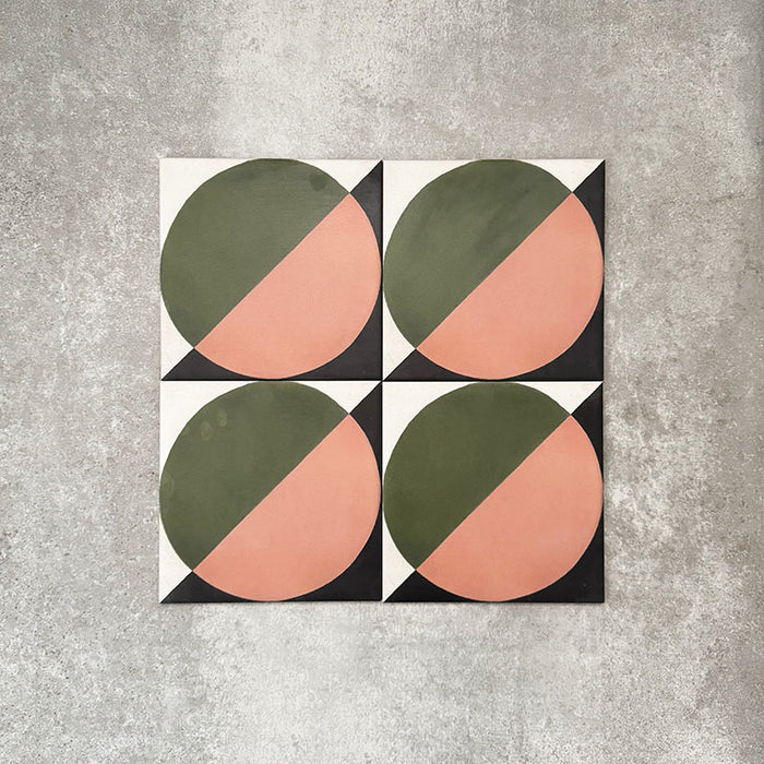 Abstract Moon Patterned Tiles in a 20x20cm format, displayed in a repeated grid layout to showcase the bold geometric circular design. The pattern combines muted green and soft blush tones with black corner accents, creating a striking yet balanced look ideal for feature walls, floors or decorative splashbacks.