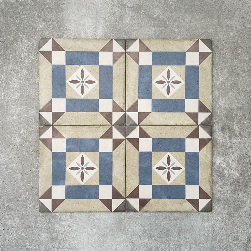 Viscount Harley Street 20×20cm Victorian-style porcelain wall and floor tiles laid in a repeating geometric square pattern with a central floral motif in soft blue, beige, warm grey and white tones, shown as a full tile layout with subtle tonal variation and floral styling.