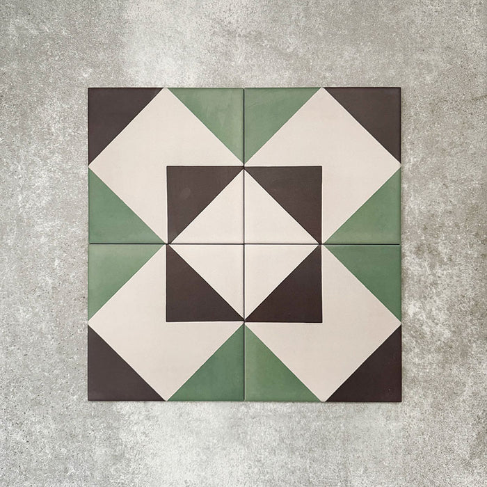 Abstract Angles Patterned Tiles in a 20x20cm format, displayed in a repeated grid layout to showcase the bold angular geometric design. Muted green, deep charcoal and soft cream tones create a clean, contemporary pattern ideal for feature walls, floors or decorative splashbacks.