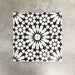Fez Winter Moroccan-style porcelain tiles arranged as a four-tile pattern, forming a striking central star motif. The 20 × 20cm tiles feature a bold black and white geometric design with crisp lines and high contrast, showcasing the full encaustic-effect pattern when laid together. Ideal for statement floors, feature walls, and contemporary or monochrome interiors.