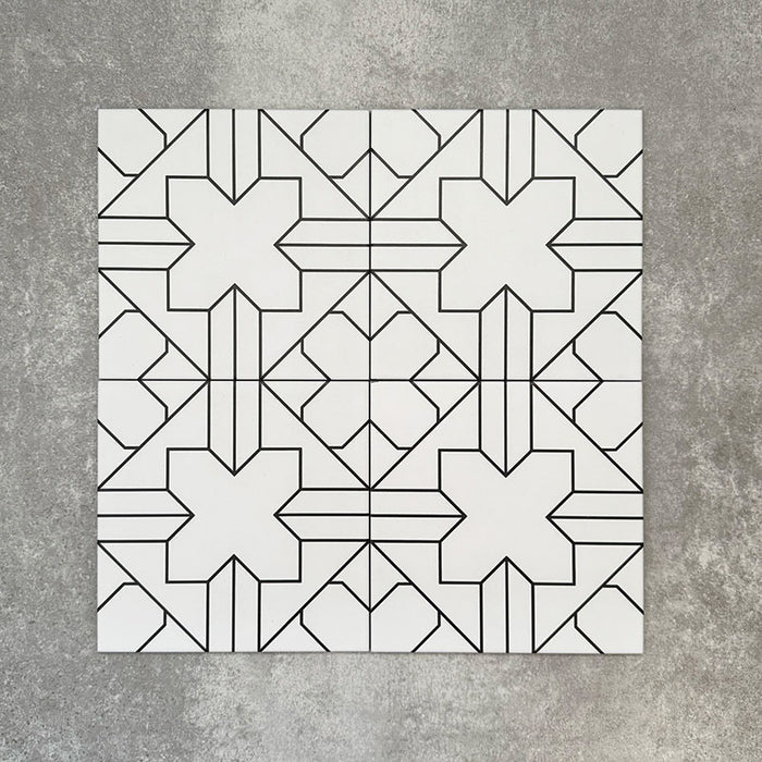 Four Almeria Palace Moroccan-style porcelain wall and floor tiles displayed together in a refined black line geometric pattern on a white base, 20x20cm.