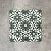 Clara Verde Victorian Moroccan-style porcelain floor tiles in a 20 × 20cm format, laid in a repeating pattern to highlight the bold green geometric design with decorative styling accents.
