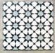 Agadir Azul Blue Moroccan-style 20x20cm porcelain tiles arranged as four tiles, showcasing a repeating geometric star pattern in blue, black and white on a neutral background.