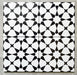 Agadir Black & White Moroccan-style 20x20cm porcelain tiles arranged as four tiles, showcasing a repeating geometric star pattern in black and white on a neutral background.