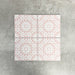 Fez Rose Pink Moroccan-style porcelain tile in a 20 × 20cm square format. The design features a soft blush pink background with a crisp white geometric starburst pattern inspired by traditional Moroccan motifs. Delicate yet detailed, the symmetrical pattern creates a light, elegant look that feels both decorative and refined—ideal for adding subtle colour and pattern to floors or walls without overwhelming a space.