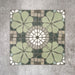 Nantes Green Moroccan-style tiles in a 20x20cm format, shown as a full pattern layout. The design features soft green floral motifs combined with circular mosaic-style detailing and neutral stone-effect tones, creating a balanced, decorative floor or wall tile pattern inspired by traditional Moroccan designs.