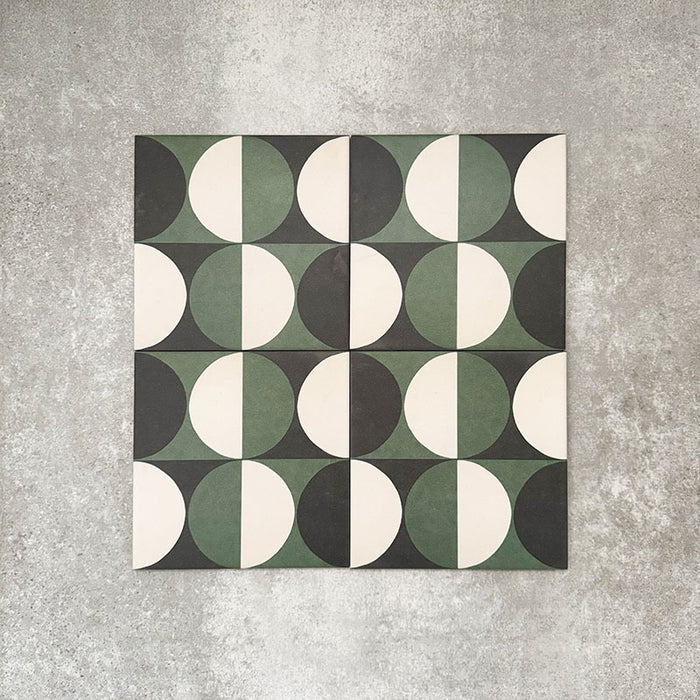 Abstract Circles Patterned Tiles in a 20x20cm format, shown in a repeating grid layout to highlight the bold circular design. Deep green, charcoal and soft cream tones create a striking yet balanced pattern, styled with floral accents to showcase the tiles as a decorative feature suitable for floors, walls or splashbacks.