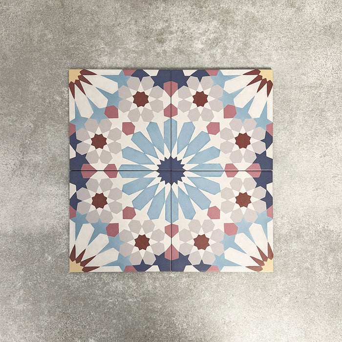 Fez Fiera Moroccan style porcelain tiles with a repeating geometric star pattern in soft blue, terracotta, grey and cream