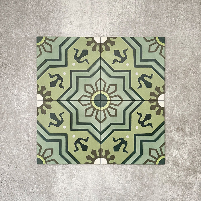Patterned layout of Balthazar Verde 20×20cm Moroccan-style porcelain tiles, showing the full encaustic-inspired geometric design in layered green tones with dark accents, ideal for creating bold feature floors or statement walls.