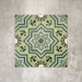 Patterned layout of Balthazar Verde 20×20cm Moroccan-style porcelain tiles, showing the full encaustic-inspired geometric design in layered green tones with dark accents, ideal for creating bold feature floors or statement walls.