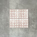 Four Berber Mequinez Rose 15×15cm Moroccan-style porcelain tiles arranged together, highlighting the soft pink and cream geometric pattern on a neutral background.