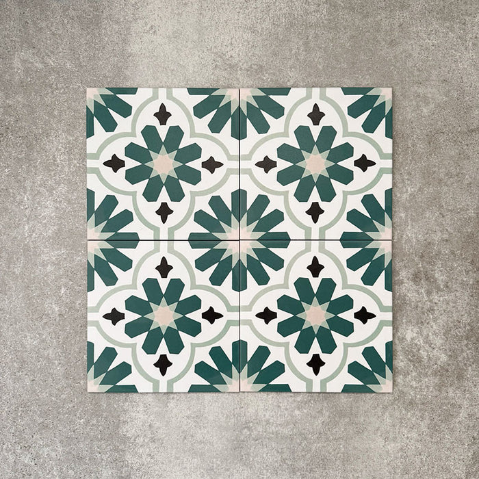 Clara Teal Victorian Moroccan-style porcelain tiles in a 20 × 20cm format, shown as four tiles laid together to demonstrate the repeating teal and green geometric pattern.