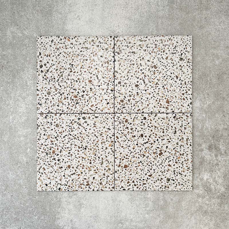 Turin Terrazzo Blanco Dots porcelain tile in a 20 × 20cm format, featuring a soft terrazzo-style design with scattered multicoloured stone fragments on a light base, shown on a neutral background to highlight the subtle texture and pattern suitable for wall and floor use.