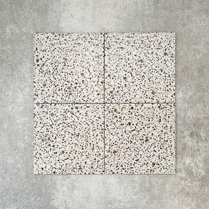 Turin Terrazzo Blanco Dots porcelain tile in a 20 × 20cm format, featuring a soft terrazzo-style design with scattered multicoloured stone fragments on a light base, shown on a neutral background to highlight the subtle texture and pattern suitable for wall and floor use.