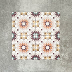 Cuba Manzanillo Moroccan-style porcelain tiles in a 20×20cm square format, arranged in a repeating geometric star pattern in soft cream, mustard, teal and burgundy tones, shown against a neutral background to highlight the tile’s crisp detailing and decorative encaustic-style design.