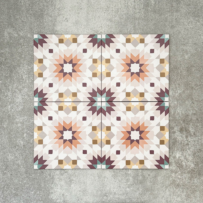 Cuba Manzanillo Moroccan-style porcelain tiles in a 20×20cm square format, arranged in a repeating geometric star pattern in soft cream, mustard, teal and burgundy tones, shown against a neutral background to highlight the tile’s crisp detailing and decorative encaustic-style design.