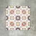 Cuba Manzanillo Moroccan-style porcelain tiles in a 20×20cm square format, arranged in a repeating geometric star pattern in soft cream, mustard, teal and burgundy tones, shown against a neutral background to highlight the tile’s crisp detailing and decorative encaustic-style design.