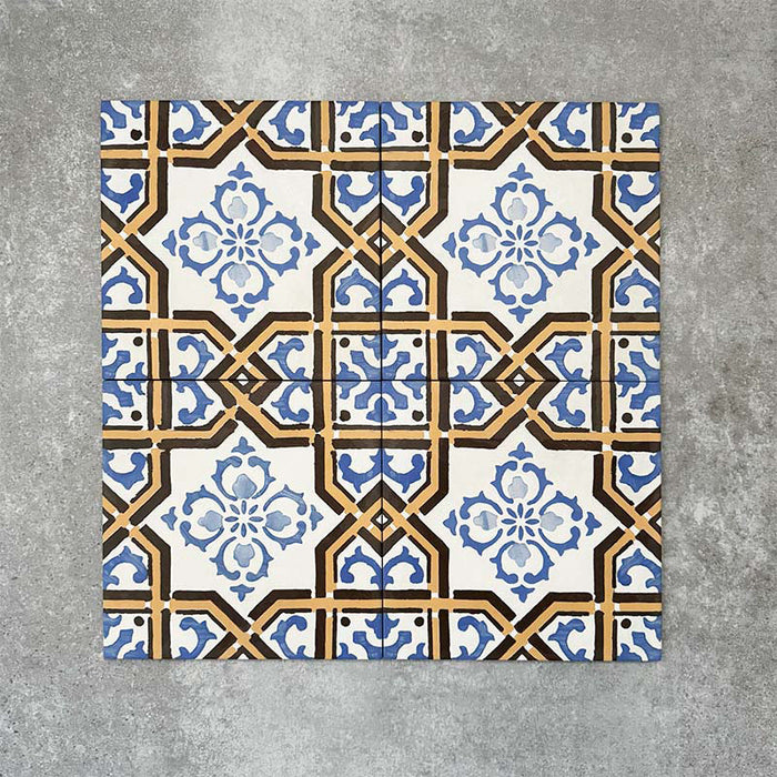 Viscount Maestro 20×20cm Victorian-style porcelain wall and floor tiles laid in a repeating ornate geometric pattern with floral detailing in blue, white and warm ochre tones, shown as a full tile layout with subtle tonal variation and floral styling.