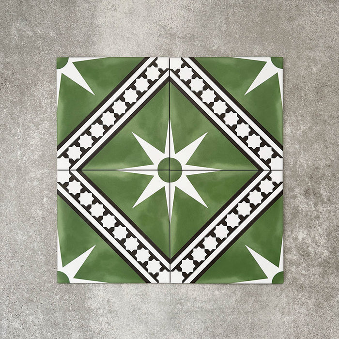 Gilgamesh Green Moroccan style 20x20cm patterned tiles, shown as a flat lay to highlight the repeating green, black and white geometric star pattern.