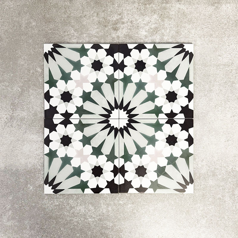 Fez Orchid Moroccan style porcelain tile with a geometric star pattern in soft green, black and white, 20cm x 20cm