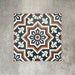 Balthazar Grand 20×20cm Moroccan-style porcelain tiles, showing the full encaustic-inspired geometric design in deep blue, warm brown and cream tones, ideal for creating bold statement floors or feature walls.
