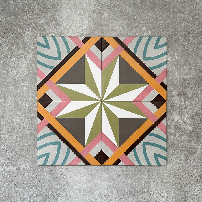 Cuba Star Moroccan-style porcelain tiles in a 20×20cm square format, arranged in a repeating geometric star pattern in soft green, blue, pink and mustard tones, shown from above to highlight the tile’s bold symmetry, crisp lines and decorative encaustic-style design.