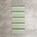 Pimlico Lime Green dado trim tiles measuring 5 × 15cm, finished with a crackle glaze and soft green tone, designed to add a decorative feature line and classic detail to ceramic wall tile installations.