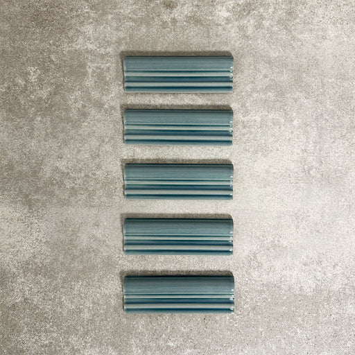 Pimlico River Blue dado trim tiles measuring 5 × 15cm, finished with a crackle glaze and deep blue tone, designed to add a decorative feature line and classic detailing to ceramic wall tile installations.