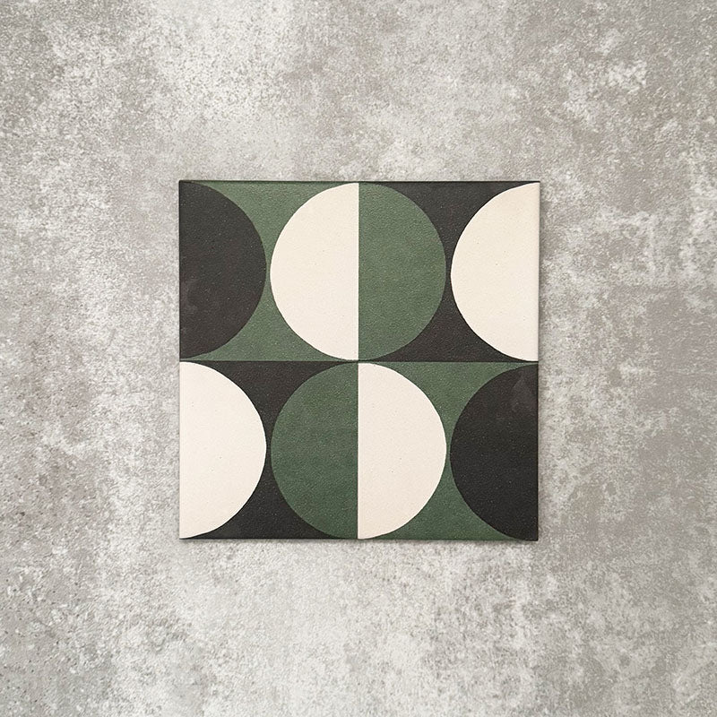 Single Abstract Circles Patterned Tile in a 20x20cm format, featuring a bold geometric design with alternating circular segments in deep green, charcoal and soft cream tones. A contemporary patterned tile ideal for feature walls, floors or statement splashbacks.