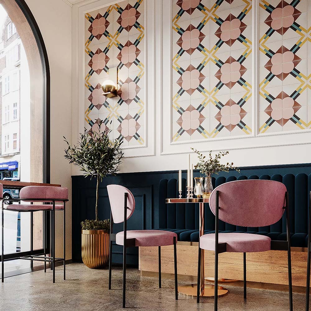 Restaurant interior featuring Abstract Contori Patterned Tiles in a 20x20cm format, installed as decorative wall panels. The elegant geometric pattern combines soft blush pink, warm neutrals and muted green accents, paired with velvet seating, marble tables and brass lighting to create a refined, contemporary dining space.