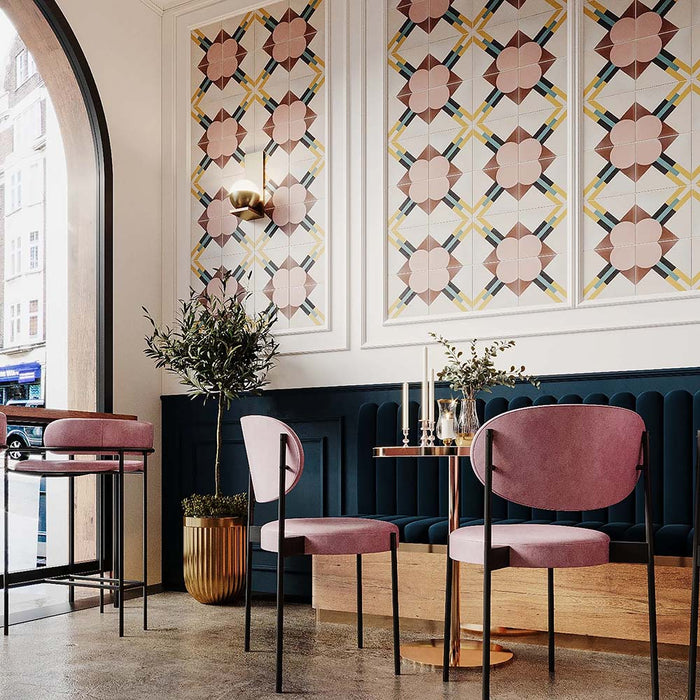 Restaurant interior featuring Abstract Contori Patterned Tiles in a 20x20cm format, installed as decorative wall panels. The elegant geometric pattern combines soft blush pink, warm neutrals and muted green accents, paired with velvet seating, marble tables and brass lighting to create a refined, contemporary dining space.