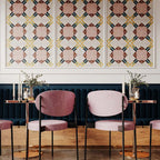Restaurant interior featuring Abstract Contori Patterned Tiles in a 20x20cm format, installed as decorative wall panels. The elegant geometric pattern combines soft blush pink, warm neutrals and muted green accents, paired with velvet seating, marble tables and brass lighting to create a refined, contemporary dining space.