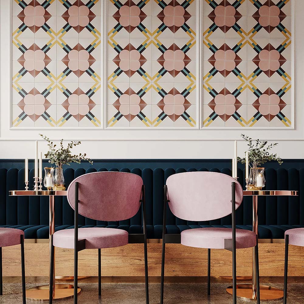 Restaurant interior featuring Abstract Contori Patterned Tiles in a 20x20cm format, installed as decorative wall panels. The elegant geometric pattern combines soft blush pink, warm neutrals and muted green accents, paired with velvet seating, marble tables and brass lighting to create a refined, contemporary dining space.