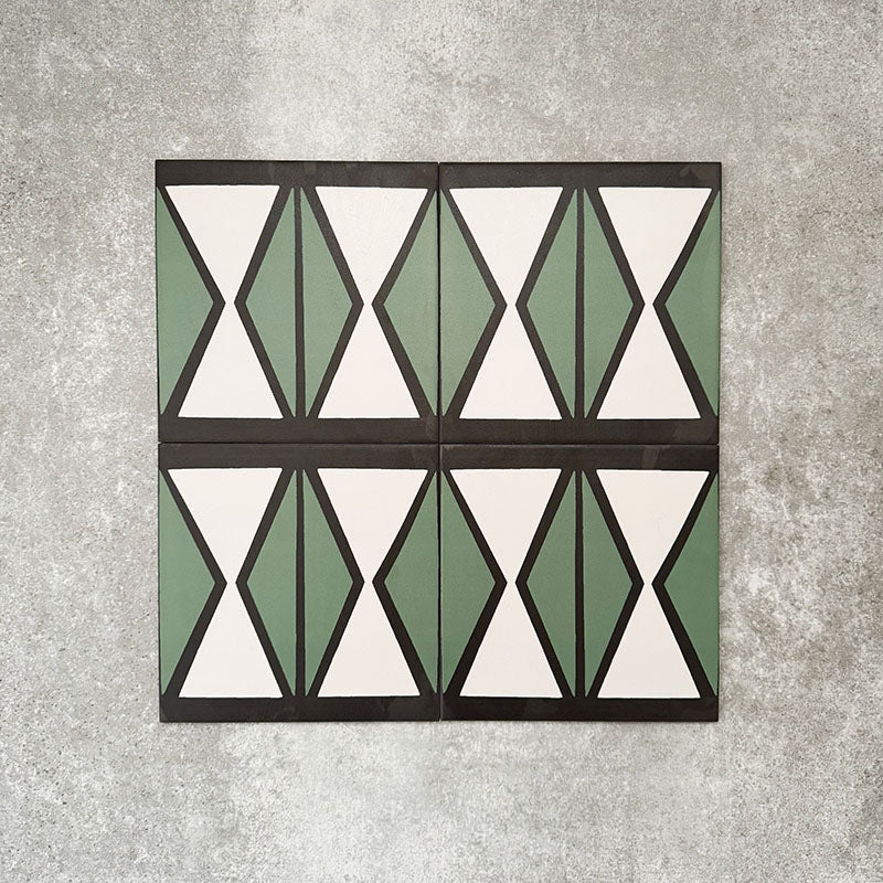 Abstract Hourglass Patterned Tiles in a 20x20cm format, displayed in a repeated grid layout to showcase the bold geometric hourglass design. Muted green and soft cream tones are framed with charcoal detailing, creating a clean, contemporary pattern ideal for feature walls, floors or decorative splashbacks.