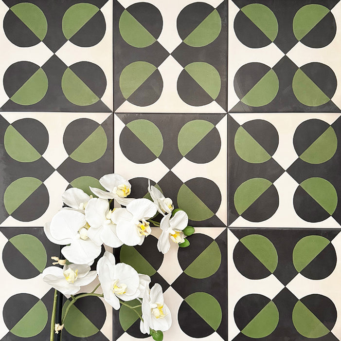 Abstract Illusion Verde Noir Patterned Tiles in a 20x20cm format, displayed in a repeated grid layout to showcase the bold optical illusion design. Deep black and rich green curved shapes contrast with a soft neutral background, creating a striking, high-impact pattern ideal for feature walls, floors or decorative splashbacks.