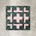 Abstract Lagoon Patterned Tiles in a 20x20cm format, displayed in a repeated grid layout to highlight the bold geometric zigzag design. Deep teal, soft pink and charcoal tones create a striking, contemporary pattern, styled with floral accents to showcase the tiles as a decorative feature suitable for walls, floors or splashbacks.