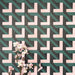 Abstract Lagoon Patterned Tiles in a 20x20cm format, displayed in a repeated grid layout to highlight the bold geometric zigzag design. Deep teal, soft pink and charcoal tones create a striking, contemporary pattern, styled with floral accents to showcase the tiles as a decorative feature suitable for walls, floors or splashbacks.