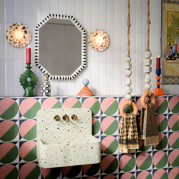 Bathroom featuring Abstract Moon 20x20cm patterned tiles in soft pink and green tones, styled with eclectic décor, statement accessories, and contemporary sanitaryware for a bold playful interior design.