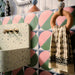 Bathroom featuring Abstract Moon 20x20cm patterned tiles in soft pink and green tones, styled with eclectic décor, statement accessories, and contemporary sanitaryware for a bold playful interior design.