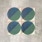 Abstract Ocean Patterned Tiles in a 20x20cm format, displayed in a repeated grid layout to showcase the bold geometric circular design. Deep blue and rich green tones are balanced with soft neutral corners, creating a fresh, contemporary look ideal for feature walls, floors or decorative splashbacks.