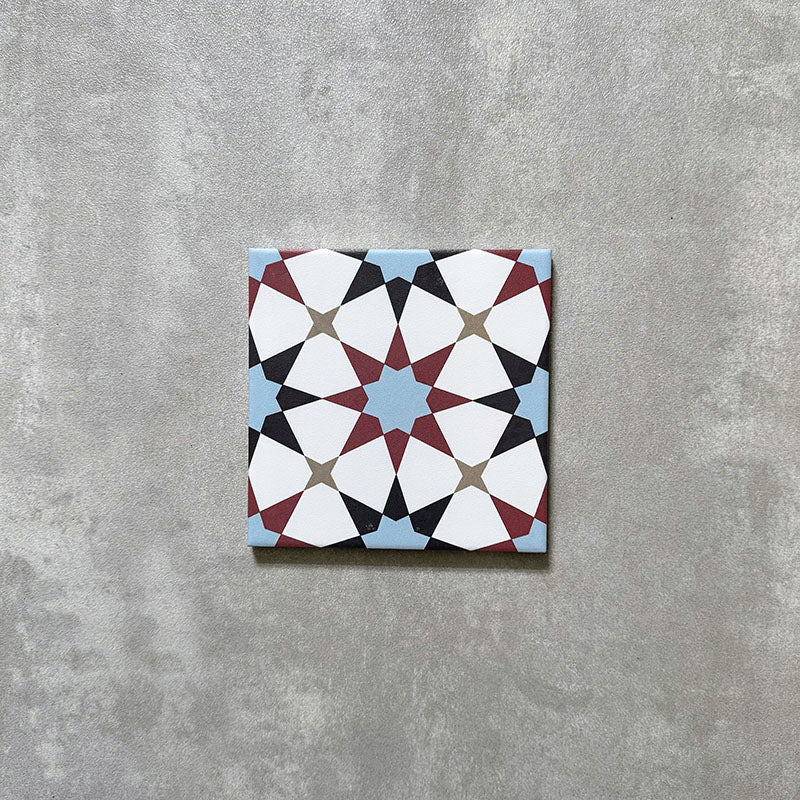 Agadir Atlas Mini Moroccan-style 15x15cm porcelain tile featuring a geometric star pattern in soft blue, burgundy, black and cream, shown as a single tile on a neutral background.