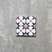 Agadir Atlas Mini Moroccan-style 15x15cm porcelain tile featuring a geometric star pattern in soft blue, burgundy, black and cream, shown as a single tile on a neutral background.