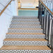 Staircase featuring Agadir Black & White Mini Moroccan-style 15x15cm porcelain tiles on the risers, showcasing a bold geometric star pattern, paired with natural wooden treads for a striking contrast.