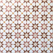 Agadir Cotto Moroccan-style 20x20cm porcelain floor tiles laid in a repeating geometric star pattern, showcasing warm terracotta, white and soft yellow tones in a coordinated tile layout.
