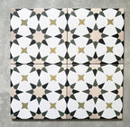Four Agadir Natural Moroccan-style 20x20cm porcelain tiles laid together, creating a continuous geometric star pattern in soft white with warm beige, olive and charcoal accents.
