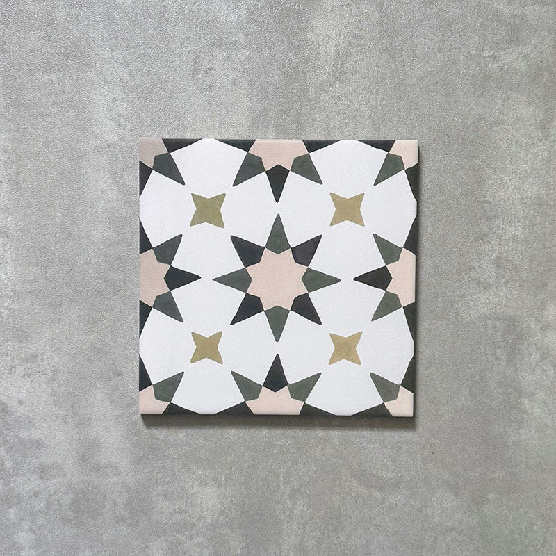 Single Agadir Natural Moroccan-style 20x20cm porcelain tile, featuring a soft neutral geometric star pattern in white with muted beige, olive and charcoal accents on a textured surface.