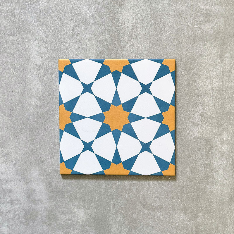 Agadir Sun and Sky Moroccan-style 20x20cm porcelain tile featuring a geometric star pattern in blue, white and warm yellow, shown as a single tile on a neutral background.